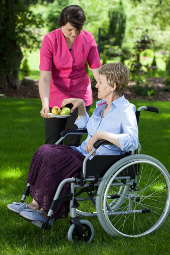 Our home care staff giving apples to patients in Maricopa County of AZ